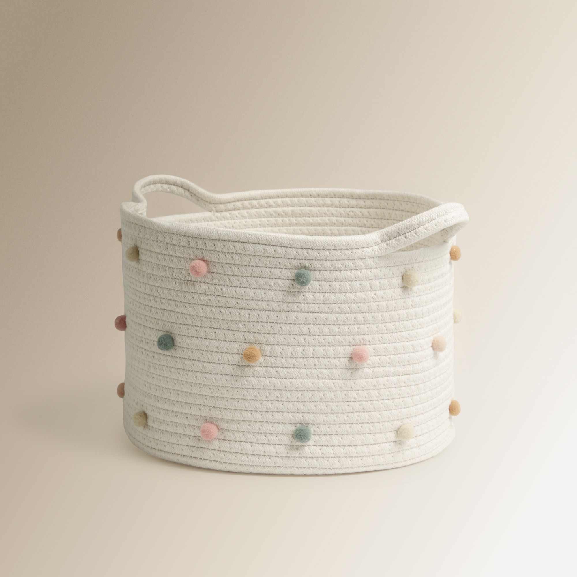 Cesta organizadora infantil cuerda pompones colores pastel blanco