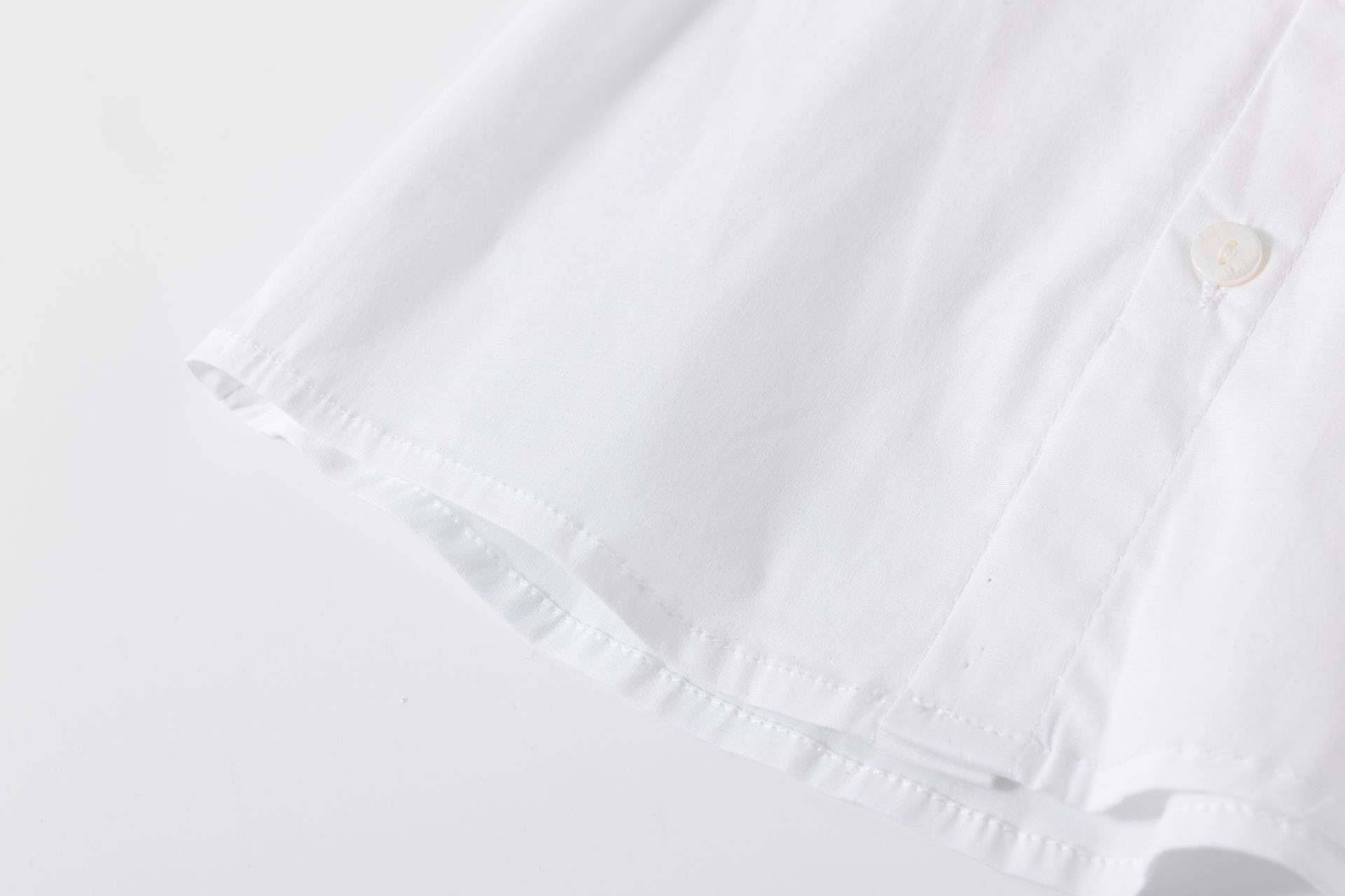 Camisa bebé niño manga larga blanca cuello picos bordado al tono delantero logo M&S trabilla manga algodón elastano