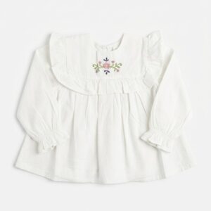 Blusa bebé niña blanco roto crema manga larga cuello babero volantes bordado floral flores rosa lila verde botones dorados delanteros puños elásticos volante