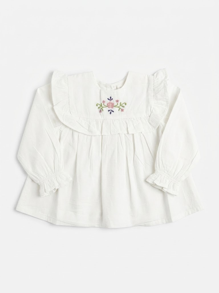 Blusa bebé niña blanco roto crema manga larga cuello babero volantes bordado floral flores rosa lila verde botones dorados delanteros puños elásticos volante