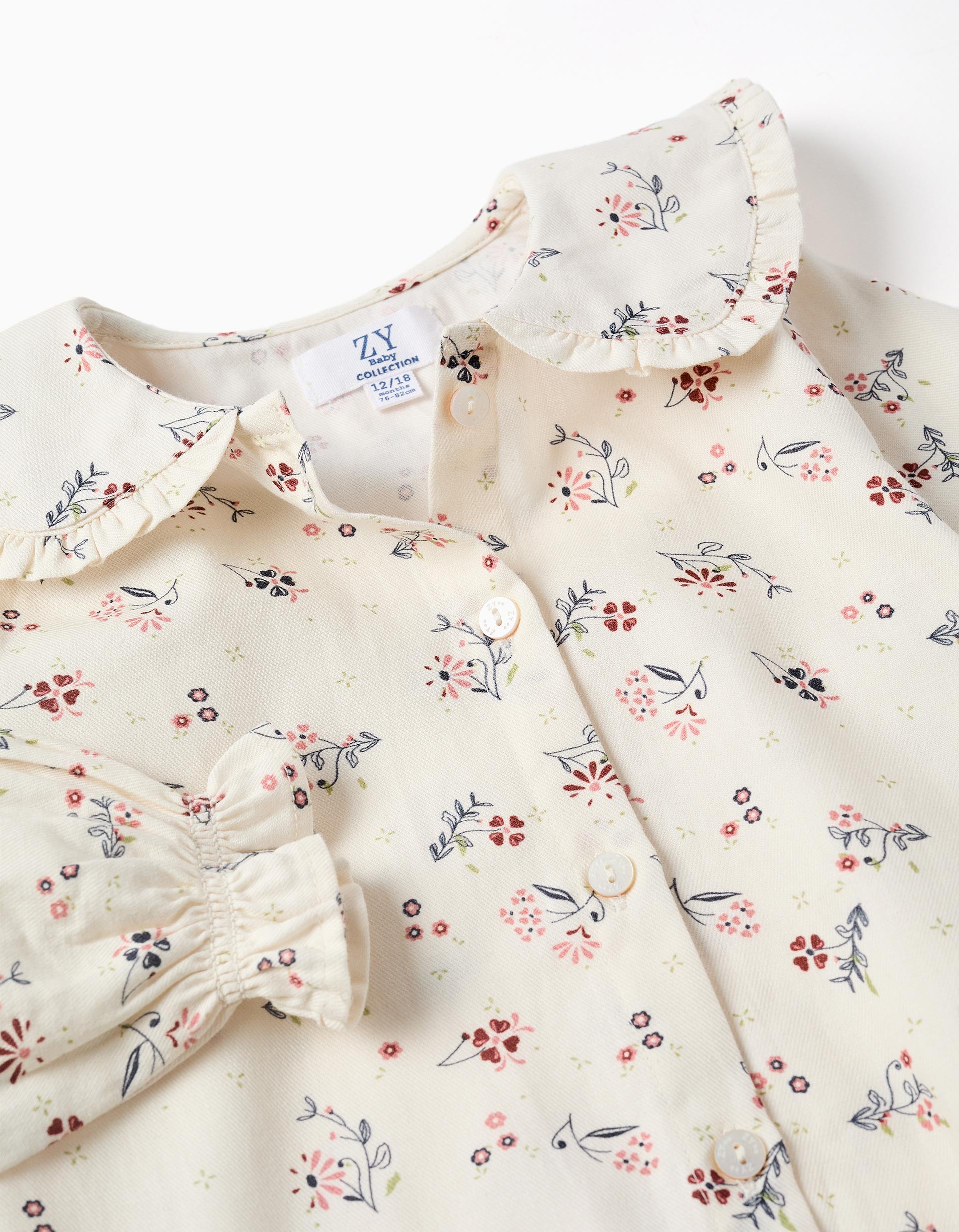 Camisa bebé niña Zippy Baby Collection blanco roto crema manga larga estampado floral flores rosa burdeos azul verde cuello babero volante botones delanteros puños elásticos volante.