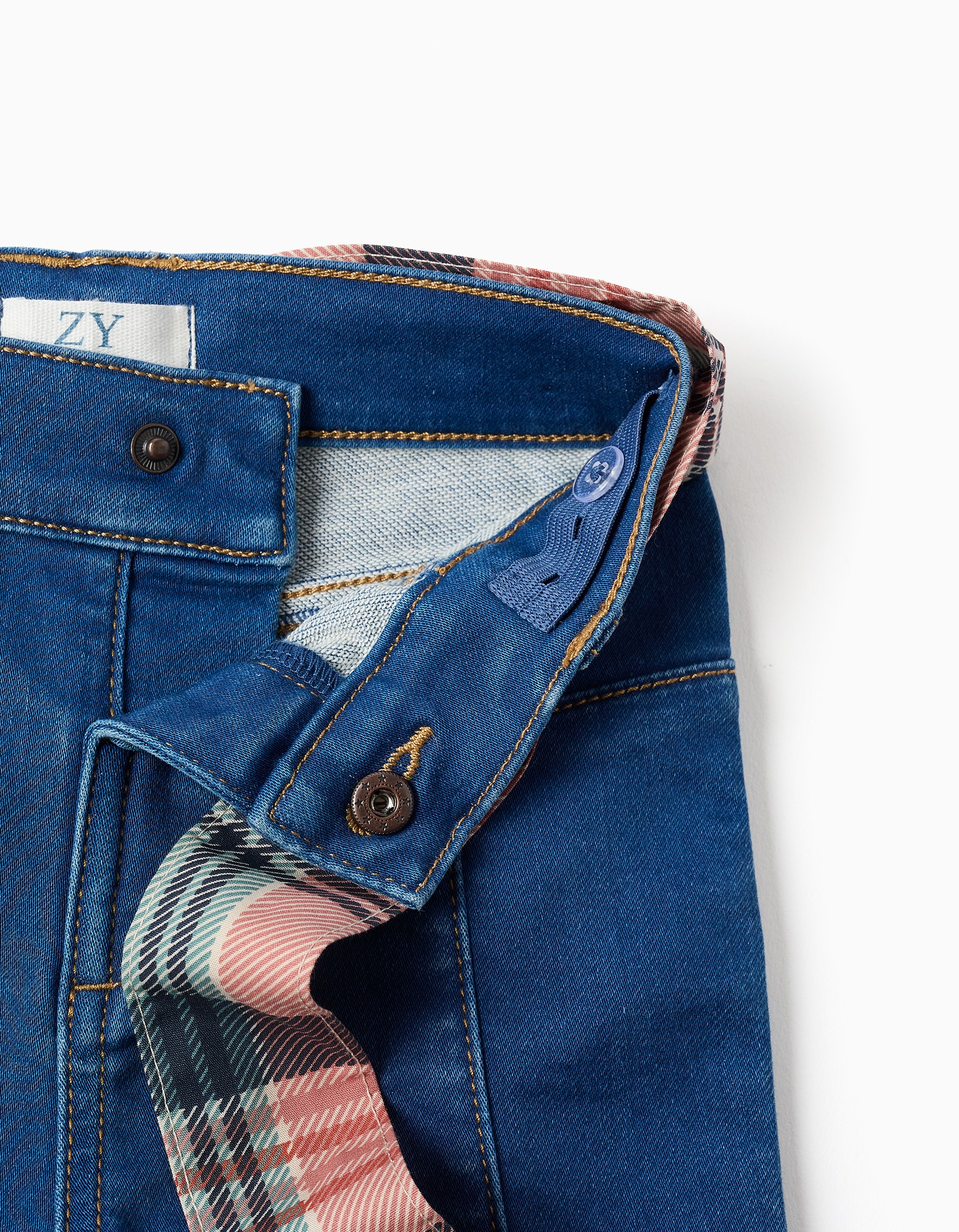 Vaqueros niña campana flare azul denim cinturón tela cuadros tartán beige rosa marrón azul cintura ajustable elástico botones internos bolsillos delanteros bolsillos parche traseros marca Zippy
