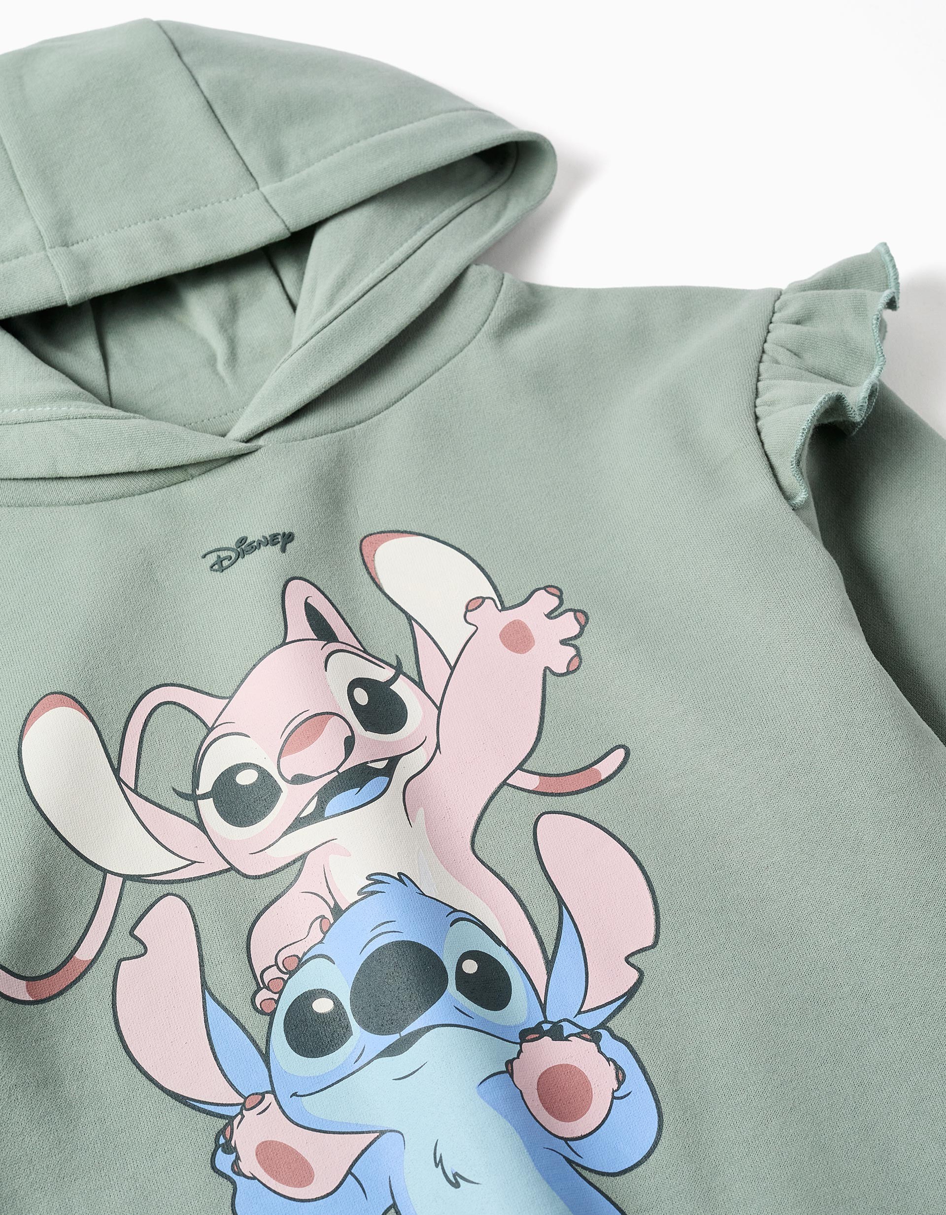 Sudadera niña verde menta con capucha volantes estampado Stitch Angel Disney texto STITCH & ANGEL mangas largas abullonadas puños bajo acanalados etiqueta manga always be close to the ones you love. sudadera stitch. zippy