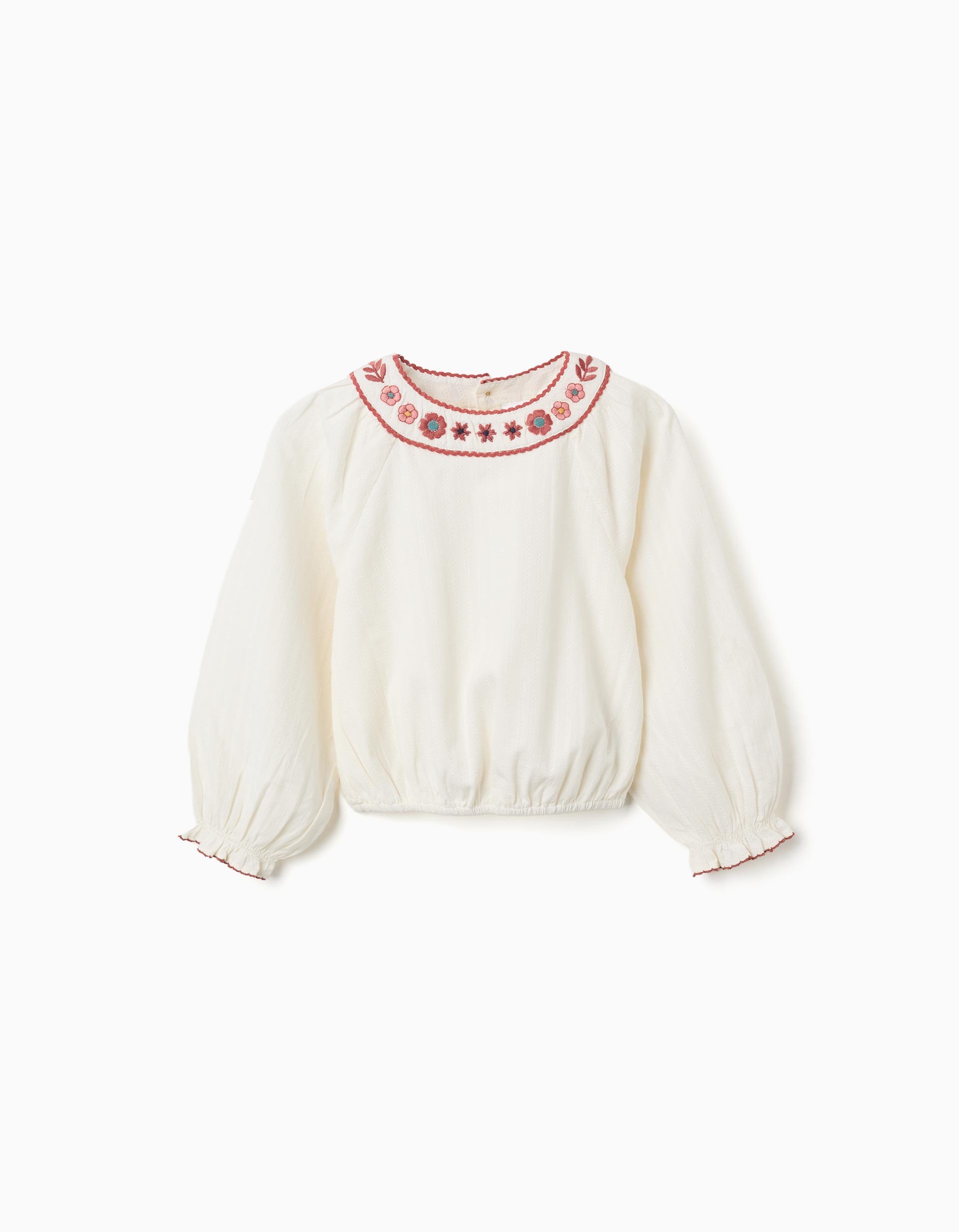 Blusa niña blanco roto cuello redondo bordado floral rojo rosa azul ribete festoneado mangas abullonadas puños elásticos bajo elástico botones madera espalda
