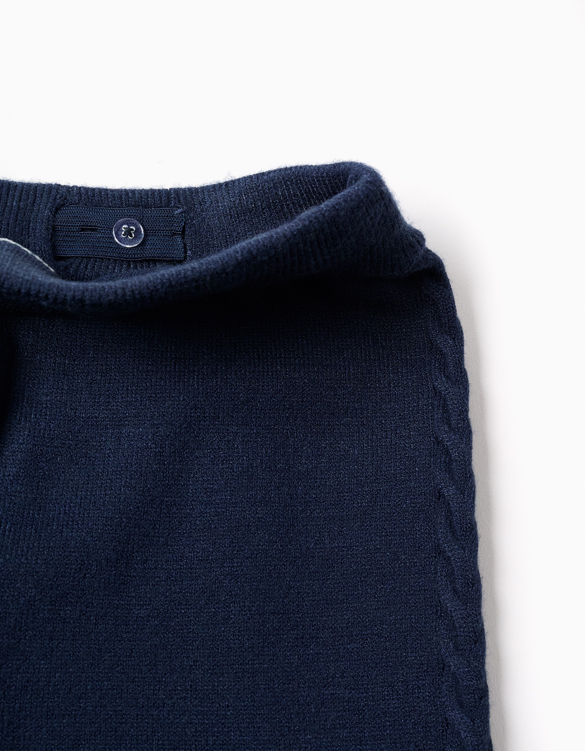 Pantalón niña punto azul marino corte culotte pierna ancha cintura elástica ajustable botones internos detalle punto trenzado laterales zippy