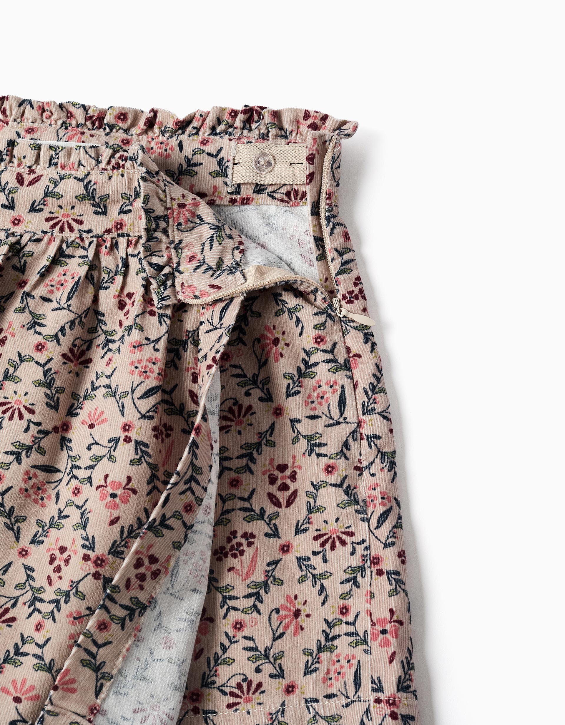 Falda niña pana fina beige claro rosa empolvado estampado floral rosa burdeos verde oscuro cintura elástica volante fruncido cremallera lateral botón