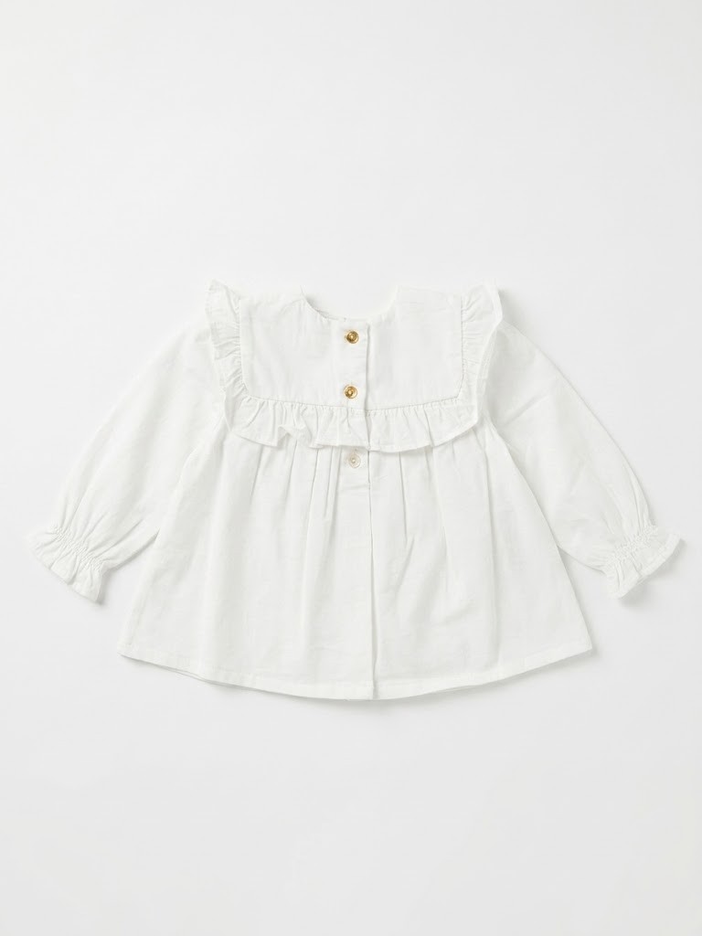 Blusa bebé niña blanco roto crema manga larga cuello babero volantes bordado floral flores rosa lila verde botones dorados delanteros puños elásticos volante
