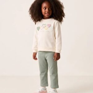 Conjunto chándal bebé niña sudadera blanca roto crema estampado corazón relieve multicolor friends live close to the heart leggings campana verde claro menta cintura elástica botones forro perchado mezcla algodón felpa Ref 31081383041, zippy