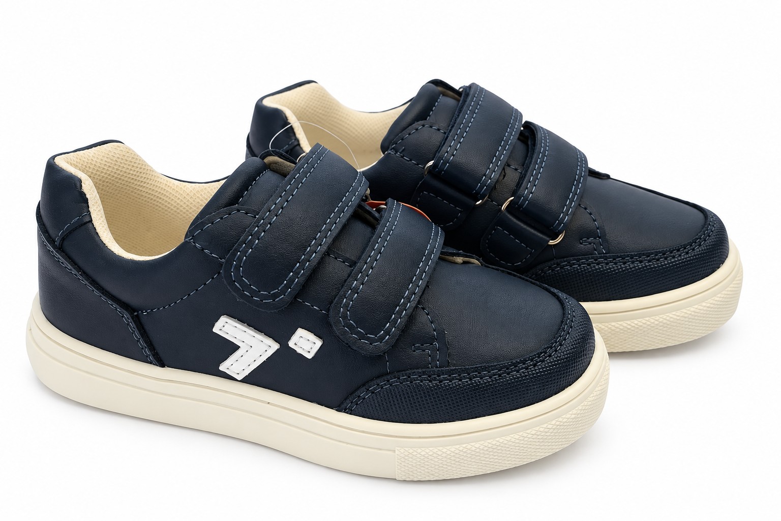 Deportivas niño niña doble velcro azul marino suela blanca flexible patrón ondulado logo lateral blanco costuras decorativas puntera reforzada interior acolchado crema blanco roto