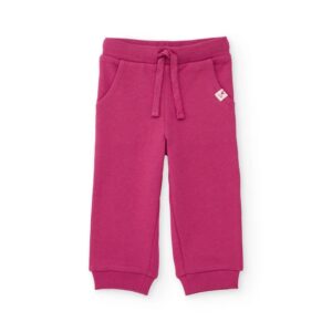 Pantalón de felpa tipo jogger para niña color fucsia cintura elástica de canalé con cordón bolsillos laterales puños ajustados