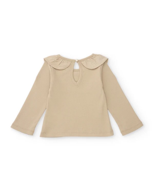 Camiseta niña manga larga beige punto canalé cuello babero con volante flor rosa bordada espalda abierta botón Tuc Tuc Camiseta niña manga larga beige punto canalé cuello babero con volante flor rosa bordada espalda abierta botón Tuc Tuc