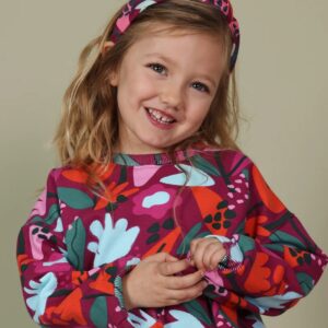 Diadema infantil con nudo central y estampado multicolor